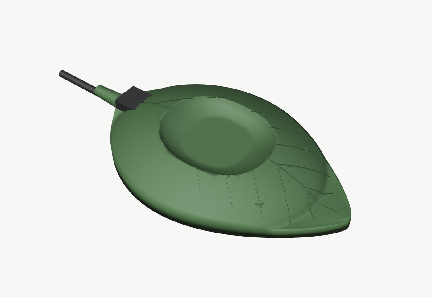 Limonchito resting in its leaf-shaped charging cradle